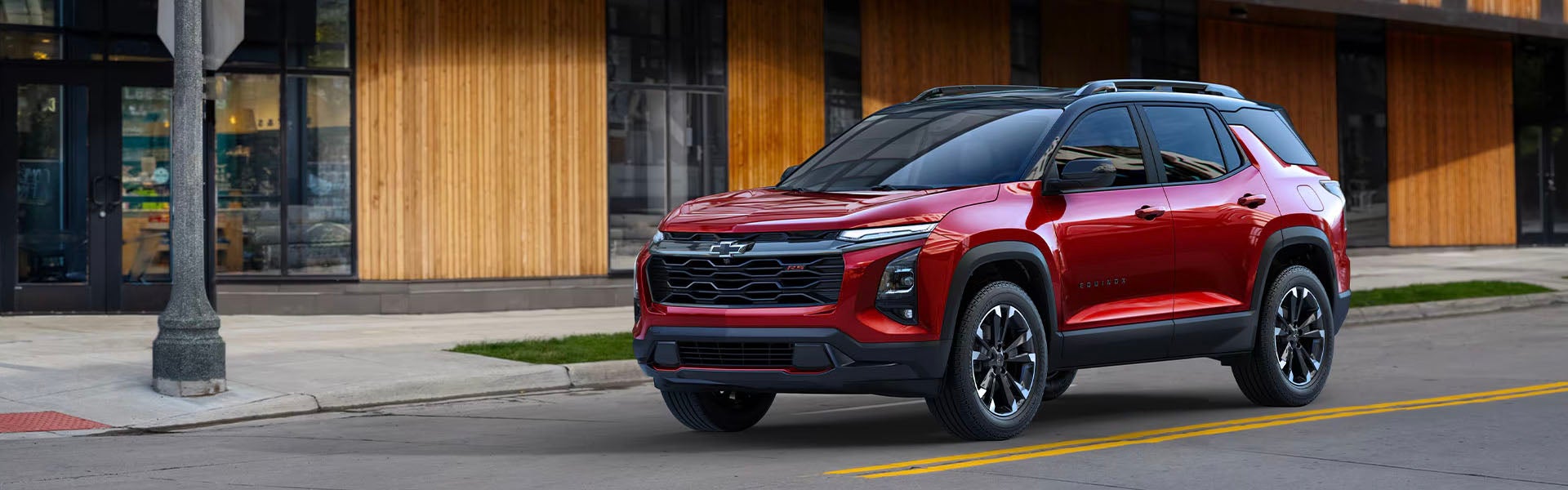 Red 2025 Chevy Equinox for sale in Topeka from the front at an angle.