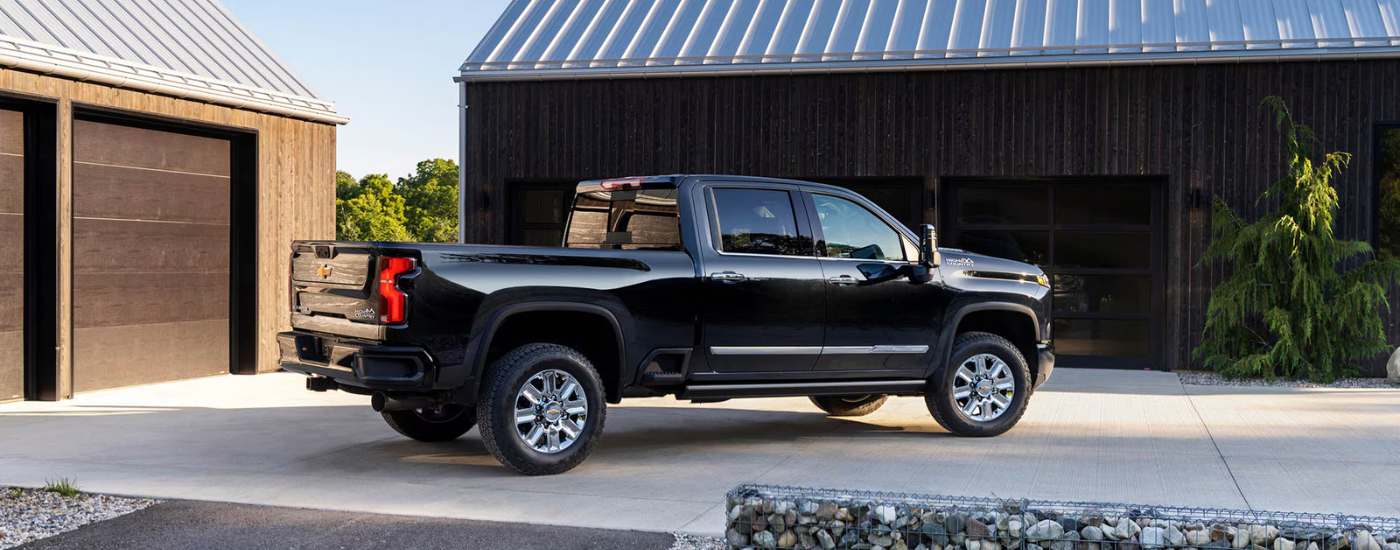 Black 2026 Chevy Silverado 2500 HD parked in a driveway
